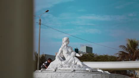 Statue-of-Venus-and-Cupid-in-a-park-named-Paseo-de-las-Musas-,-which-is-adorned-with-statues,-monuments,-and-gardens-in-the-province-of-Chiclayo,-Lambayeque-in-Peru