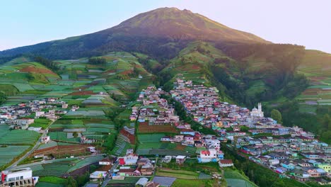 Aerial-view-of-mountain-slope-become-plantation-and-settlement