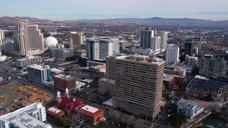 Reno,-Nevada-USA,-Aerial-View-of-Downtown-Buildings,-Casinos-and-Street-Traffic-in-Winter-Season