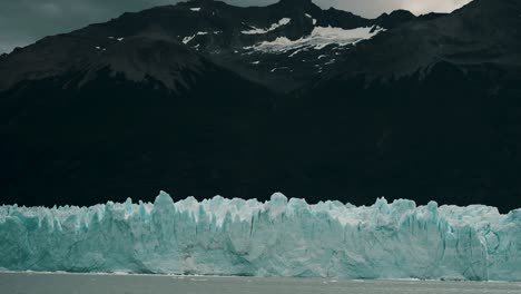 Perito-Moreno-Glacier-Backdropped-By-Mountain-Range-Near-El-Calafate-In-Argentina