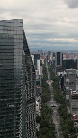 Drone-footage-of-the-skyscrapers-on-Paseo-de-la-Reforma,-vertical-mode