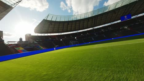 Uefa-Euro2024-Olympiastadion-Berlin-FPV-Drohne-Fliegt-Von-Eckfahne-Zum-Tor-über-Grünes-Spielfeld-Leeres-Stadion