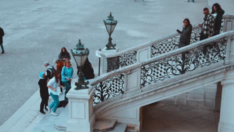 People-using-the-stairs-at-Schönbrunn-Palace-in-Vienna,-Austria