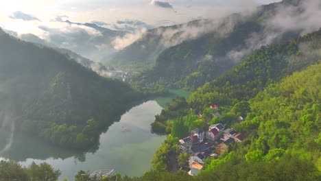 Aerial-photo-of-Tonglu-Mountain-Village-in-Hangzhou,-Zhejiang,-China,-surrounded-by-clouds-and-mist-in-the-early-morning