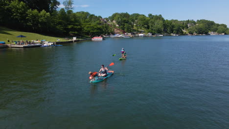 Dog-Rides-Paddle-Board-with-Woman-on-Calm-Lake