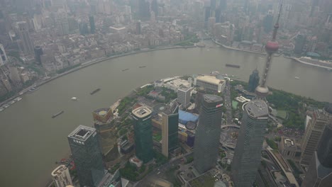 Pudong-Financial-District-and-its-modern-buildings-next-to-Hangpu-River-in-tilt-up-shot