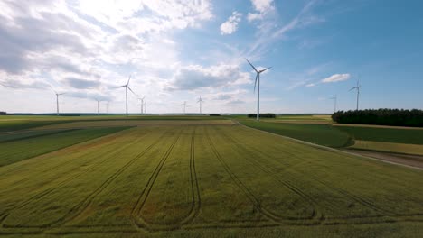 Aerial-FPV-view-of-sunny-day-wind-turbine-farm