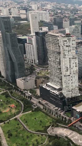 Panoramic-view-of-office-and-apartment-buildings-in-Santa-Fe-financial-district-CDMX,-vertical-mode