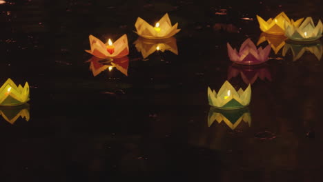 ground-of-paper-light-candle-floating-on-river-water-at-night-for-annual-Vesak-Buddhist-festivals-celebration-in-south-East-Asia