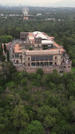 Drone's-eye-front-view-of-Chapultepec-Castle,-CDMX,-in-vertical-mode