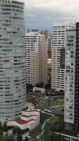 Vertical-shot-of-office-and-housing-structures-in-Santa-Fe's-financial-hub,-Mexico-City