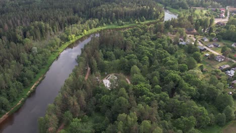 An-aerial-view-of-Valmiera-city,-showcasing-its-blend-of-urban-and-natural-elements