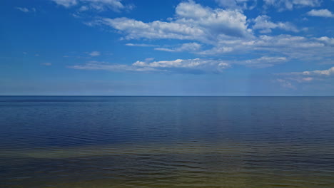 Serenity-Over-Seascape-With-Blue-Sky-And-Clouds