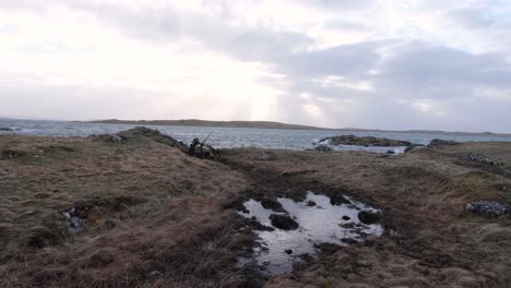 Coastal-and-ocean-landscape-view-of-Berneray-in-the-Outer-Hebrides-of-Scotland-during-windy,-wet-and-wild-weather-in-outdoor-wilderness