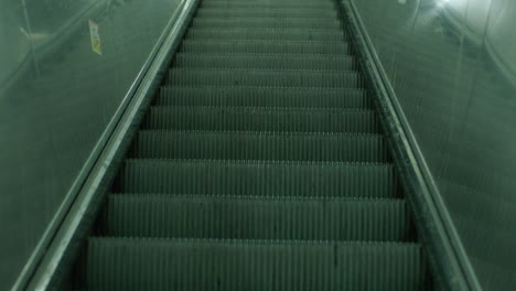 Empty-subway-escalator-in-low-light,-capturing-a-sense-of-urban-solitude-and-transit