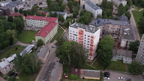 An-aerial-view-of-Valmiera-city,-showcasing-its-blend-of-urban-and-natural-elements