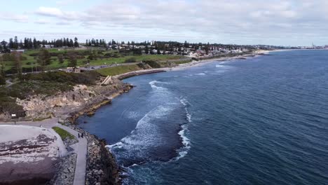 Aerial-view-to-South-Cottesloe-Beach,-over-groin,-Perth,-Western-Australia