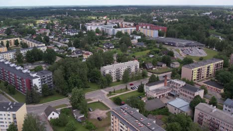 An-aerial-view-of-Valmiera-city,-showcasing-its-blend-of-urban-and-natural-elements