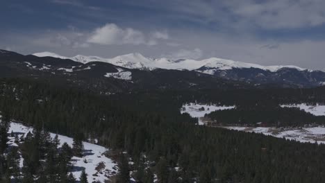 Mount-Blue-Sky-Evans-Evergreen-Colorado-aerial-drone-parallax-14er-Rocky-Mountain-North-Turkey-Creek-Rd-Marshdale-landscape-spring-snow-melting-morning-sunny-cloudy-circle-left-motion