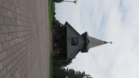 Aerial-View-Over-Usma-Wooden-Lutheran-Church,-Latvia