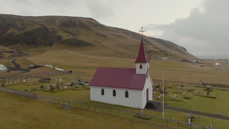 Aerial-drone-shot-of-Reyniskirkja-Church-in-Iceland