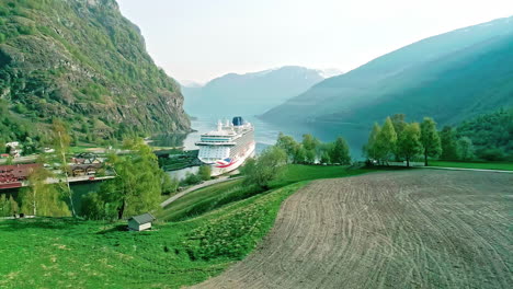 Ferry-In-A-Beautiful-Fjord-In-Flam,-Southwestern-Norway---Drone-Pullback