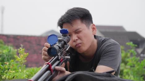 Sharpshooting-asian-with-scoped-PCP-air-rifle