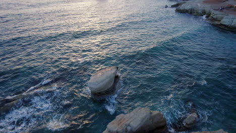 A-dramatic-view-of-the-Edro-III-shipwreck-off-the-coast-of-Cyprus-at-sunset,-capturing-the-rusted-hull-and-serene-seascape