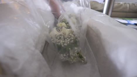 Taking-off-the-plastic-wrapping-in-slow-motion