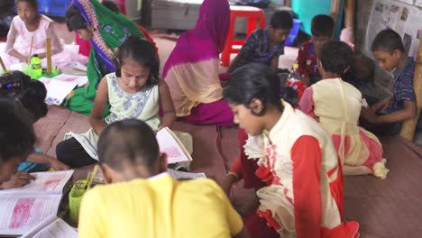 A-group-of-poor-child-reading-in-a-school-of-Bangladesh