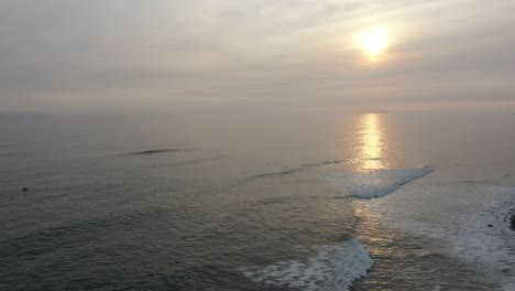 Beautiful-aerial-view-of-sunset-at-the-well-known-surfers-beach-in-Peru,-Punta-rocas