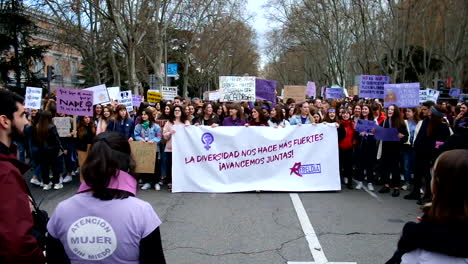 Women-marching-at-the-8M-Women's-Day-march-in-Madrid,-Spain
