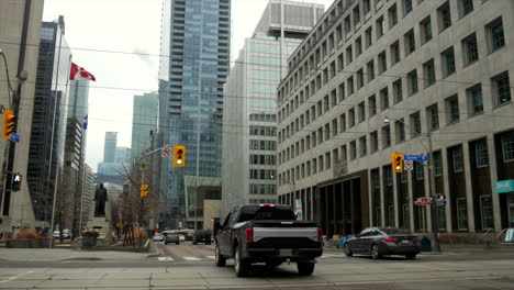 Handheld-shot-Downtown-busy-traffic-morning,-Toronto