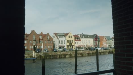 View-of-the-water-with-small-waves-in-the-harbor-of-Husum,-North-of-Germany,-Slow-Motion