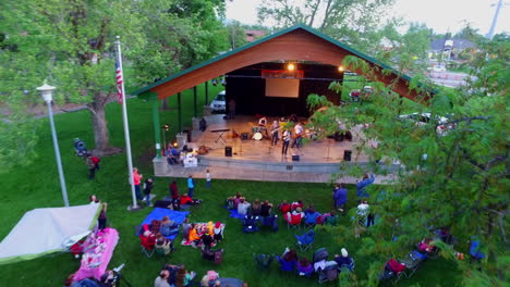 A-drone-shot-of-an-end-of-summer-concert-as-the-drone-flies-over-you-see-a-performance-taking-place