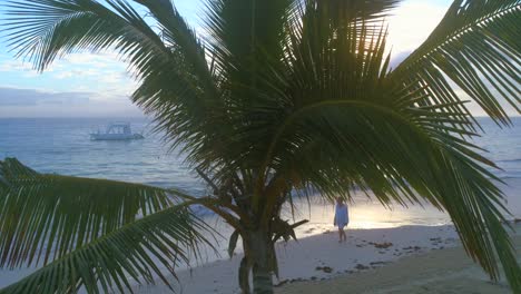 Man-walking-on-seashore-of-Punta-Cana-beach-at-sunset