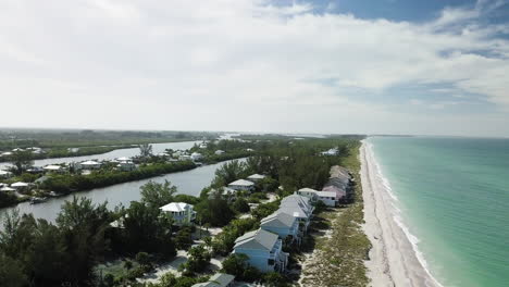 Mavic-drone-flying-25'-above-peach-with-a-slow-push-down-the-coast-line