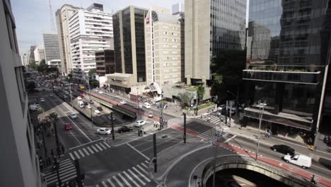 Wide-shot-of-buses-and-cars-during-traffic-on-Sao-Paulo-Avenida-Paulista-during-day,-Brazil