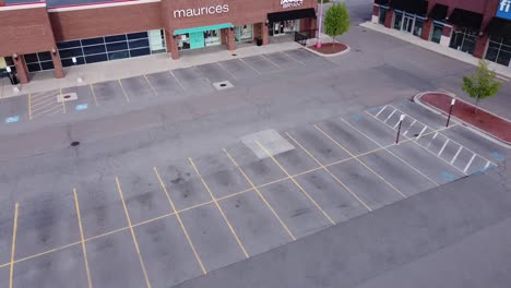 Empty-Parking-Lots-And-Retail-Stores-Due-To-Corona-Virus-Lockdown-In-Brownstown-Michigan---aerial-shot