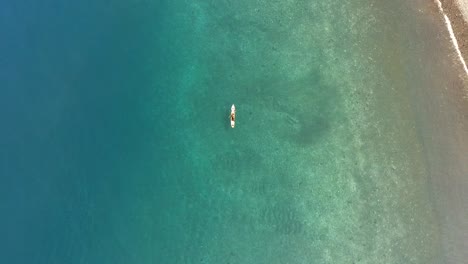 Aerial-view-from-top-fisherman-boat-on-blue-water,-São-Tomé-Island