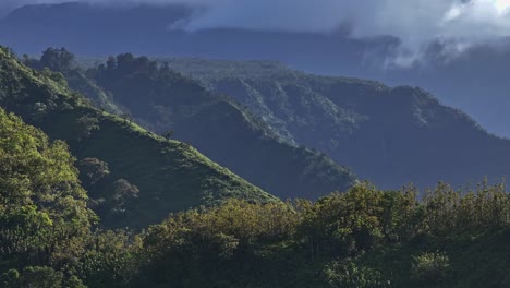 Cinematic-view-of-mountains-with-lush-greenery-of-Maui-north-shore-from-road-to-Hana,-Hawaii