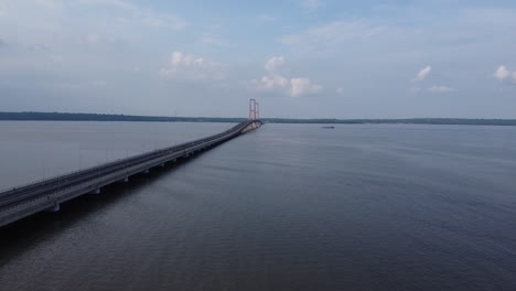 aerial-view-of-the-Suramadu-bridge,-the-longest-bridge-in-Indonesia-connecting-the-islands-of-Java-and-Madura