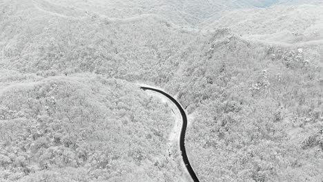 Snowy-mountains-and-road-with-drones-Seoraksan,-South-Korea