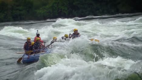 A-group-of-adventurous-people-enjoying-the-extreme-sport-of-rafting-in-the-white-and-rough-waters-of-Nile-river
