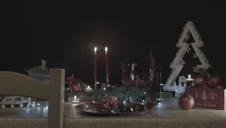 Christmas-decorated-table-in-a-dark-room-with-smoke-coming-out-of-a-bowl