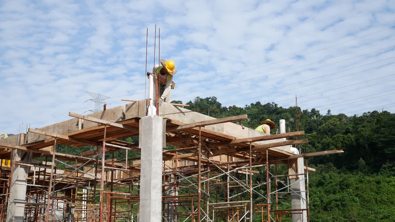 Construction Workers Installing Timber Form Works And Rain Water Down ...