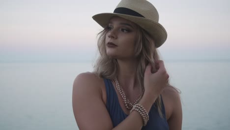 Beautiful-Woman-Taking-A-Pose-For-Photo-Shoot---Wearing-Tank-Top,-Hat,-And-Jewelries-In-Ontario,-Canada---Close-Up-Shot