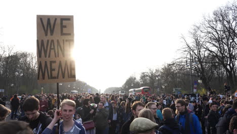 Young-man-holding-up-sign-that-says-"We-Want-Meme"-at-Article-13-protest-in-Berlin-Germany