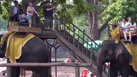 Tourists-Dismount-After-Riding-Elephants-Near-Angkor-Wat