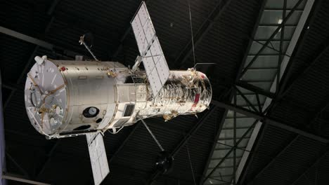 Hubble-Telescope-Replica-suspended-from-hangar-roof-in-learning-area-of-Boeing-Flight-Museum-in-Seattle,-Washington